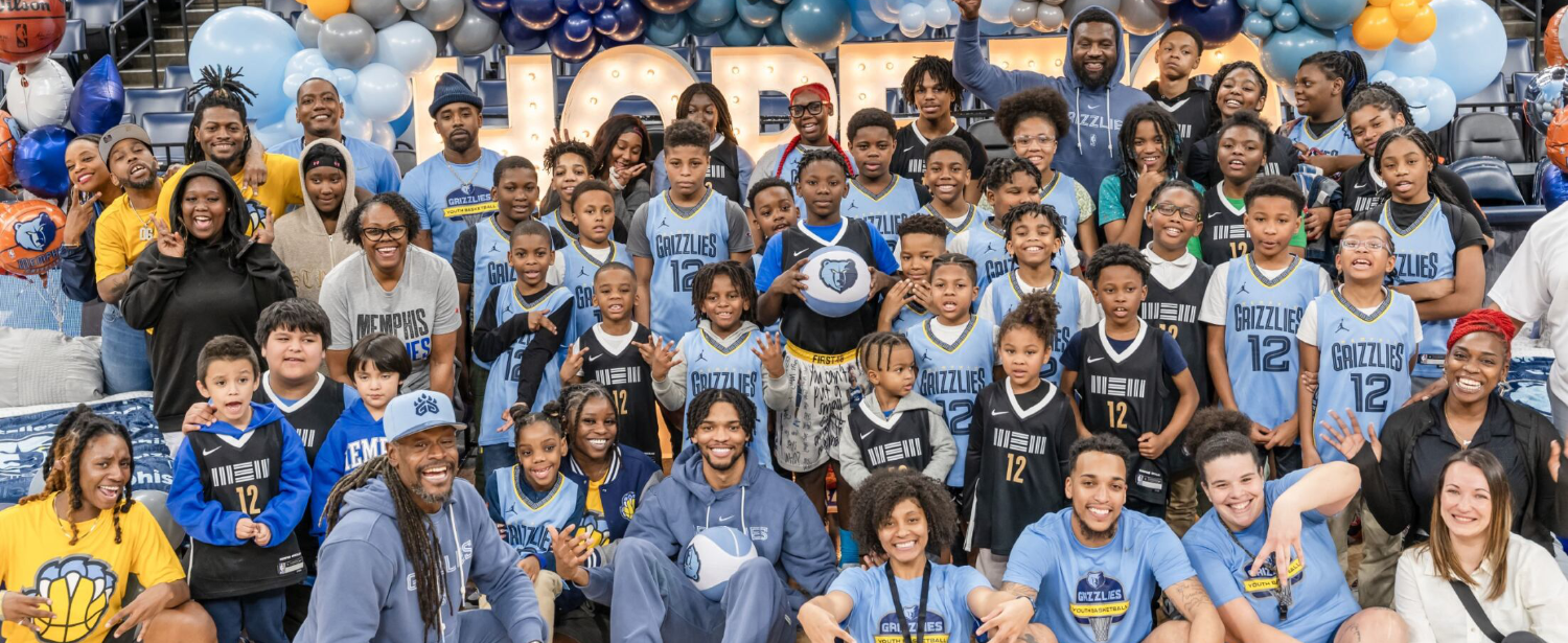 group photo of the youth from Ashley furniture and Grizzlies event